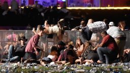 People scramble for cover at the Route 91 Harvest country music festival after gun fire was heard on October 1, 2017 in Las Vegas, Nevada.