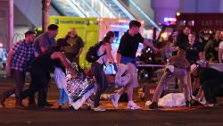 LAS VEGAS, NV - OCTOBER 02: An injured person is tended to in the intersection of Tropicana Ave. and Las Vegas Boulevard after a mass shooting at a country music festival nearby on October 2, 2017 in Las Vegas, Nevada. A gunman has opened fire on a music festival in Las Vegas, killing over 20 people. Police have confirmed that one suspect has been shot dead. The investigation is ongoing. (Photo by Ethan Miller/Getty Images)