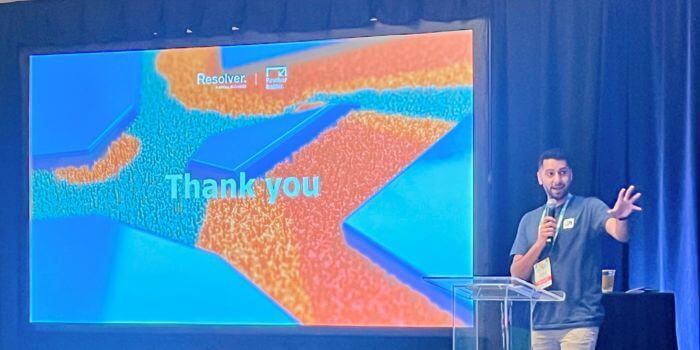 Reflecting on ascend 2024: resolver security summit 4 Riz shirazi presenting at ascend 2024 with a 'thank you' slide displayed on the screen behind him, showcasing resolver's branding.