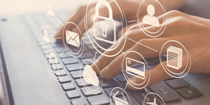 Hands typing on a laptop keyboard with digitally imposed images overtop representing corporate security roi