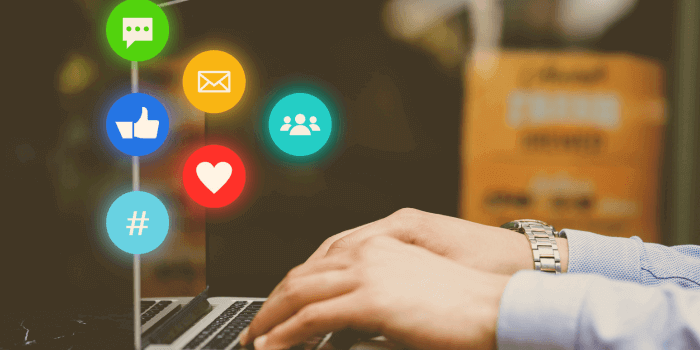 Hands typing on laptop with digital icons overtop representing social media investigations