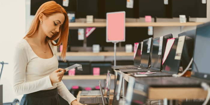 Woman browsing for laptops representing tech for retail loss prevention